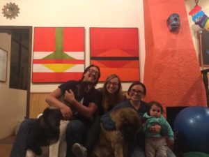 Family photo with a dog inside a house in Ecuador