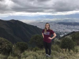 Girl posing on top of a mountain in Ecuador