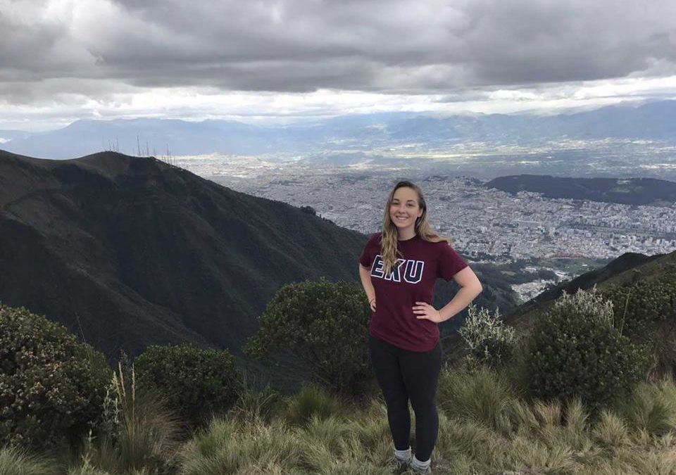 Girl posing on top of a mountain in Ecuador